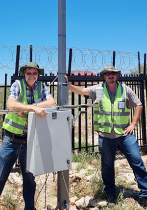 C.W. Price employees with installed weather monitoring equipment